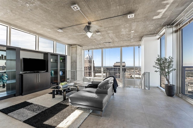 living room featuring floor to ceiling windows