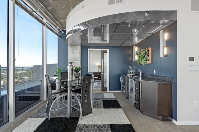 interior space with expansive windows and beverage cooler