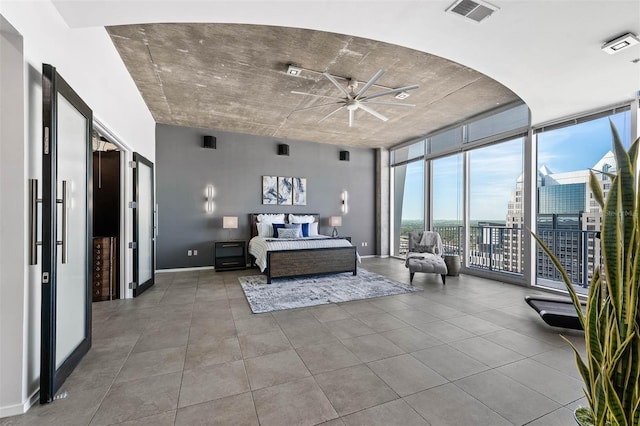 bedroom featuring floor to ceiling windows