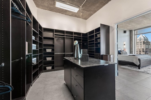 spacious closet featuring light tile patterned flooring