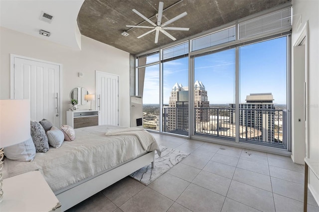 bedroom with access to outside and floor to ceiling windows