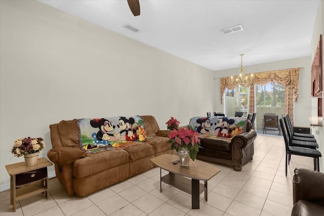 living room with light tile patterned floors and ceiling fan with notable chandelier