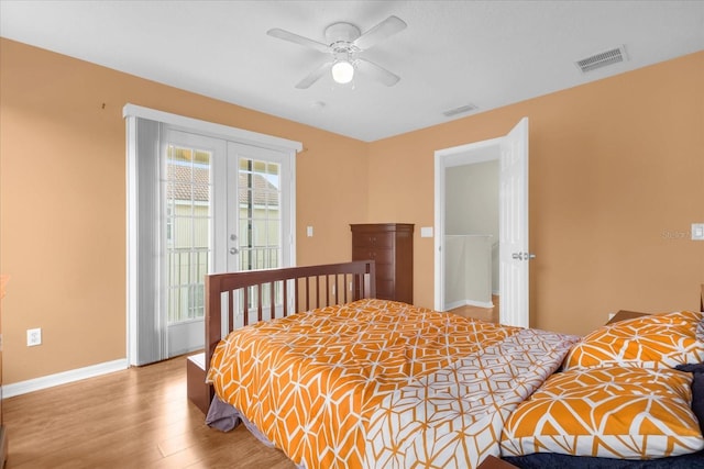 bedroom with ceiling fan, access to exterior, light wood-type flooring, and french doors