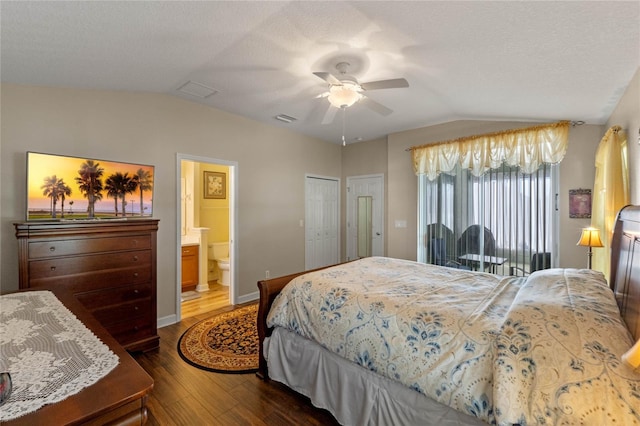 bedroom with connected bathroom, ceiling fan, a textured ceiling, lofted ceiling, and hardwood / wood-style flooring