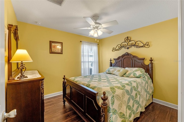 bedroom featuring ceiling fan and dark wood-type flooring