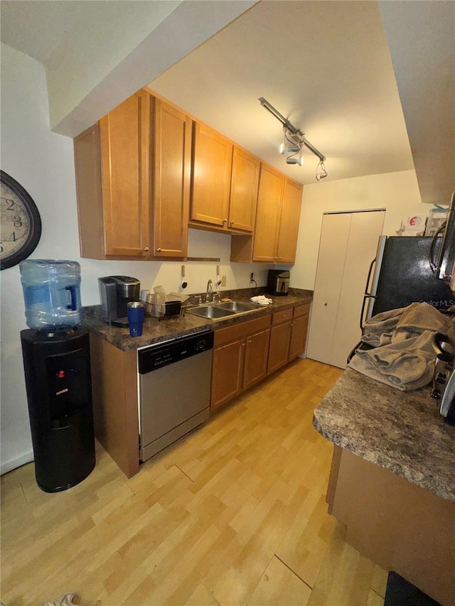 kitchen with dishwasher, refrigerator, rail lighting, sink, and light hardwood / wood-style flooring