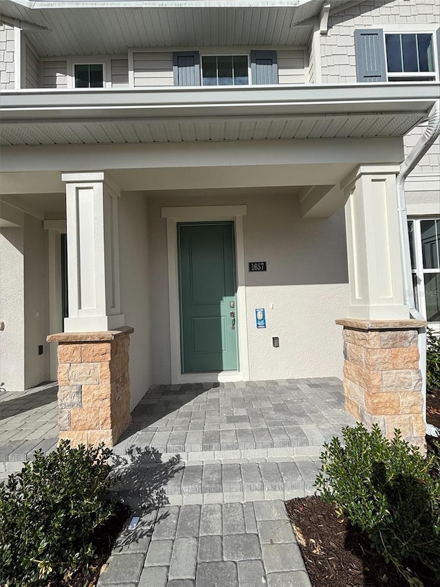 entrance to property with a porch