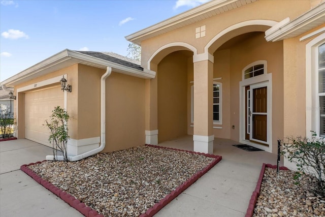 doorway to property featuring a garage