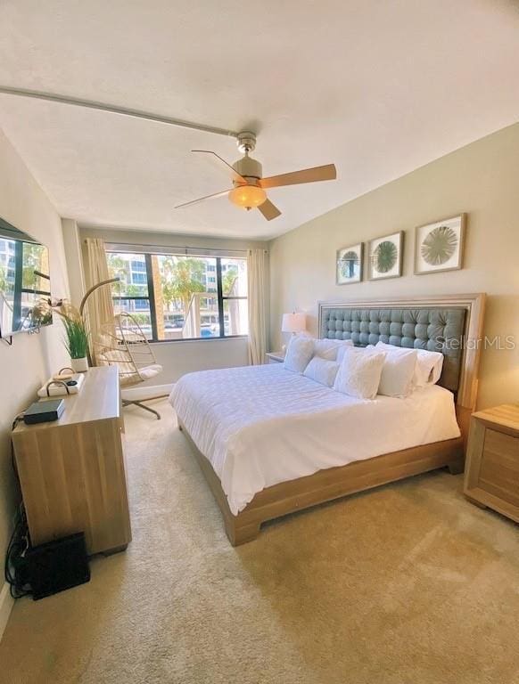 carpeted bedroom with ceiling fan