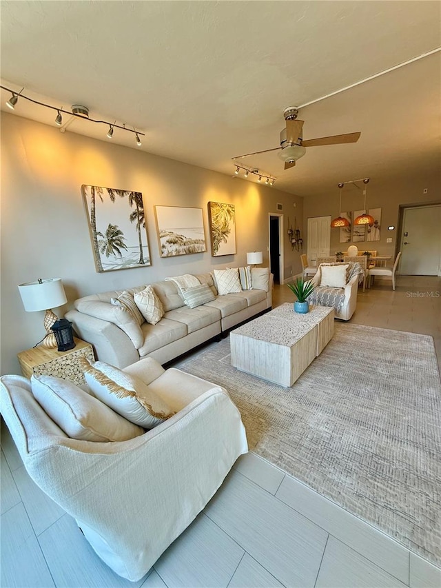 5855 Midnight Pass Rd Unit 108, Sarasota, FL 34242 - living area with track lighting and ceiling fan