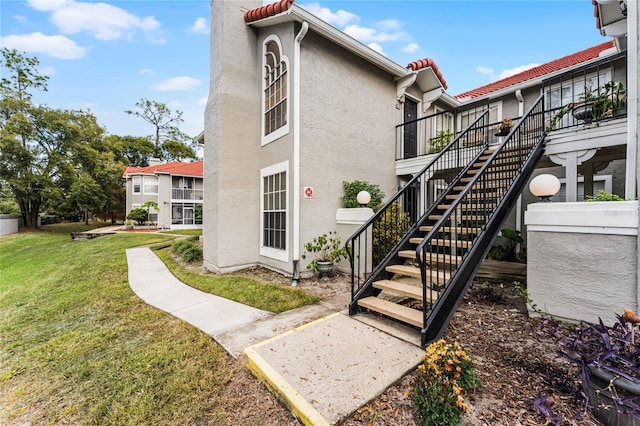 view of property exterior with a lawn