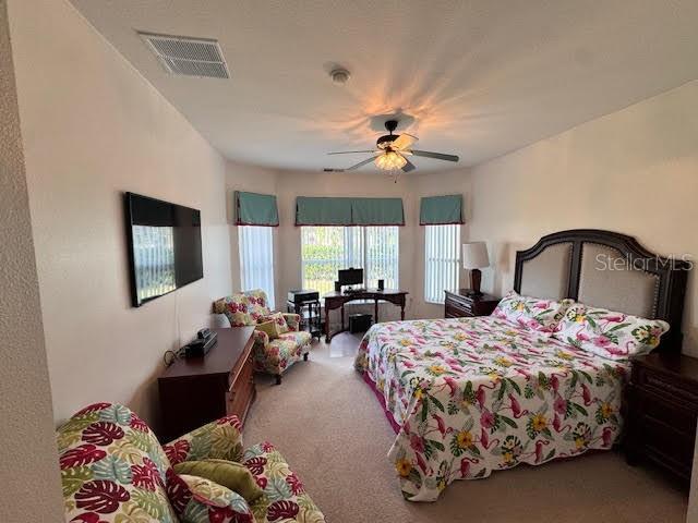 bedroom featuring carpet and ceiling fan