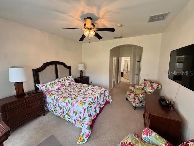 carpeted bedroom with ceiling fan