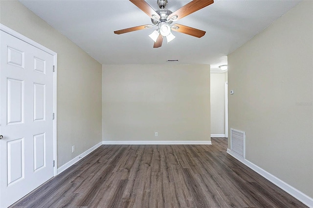 spare room featuring dark hardwood / wood-style floors