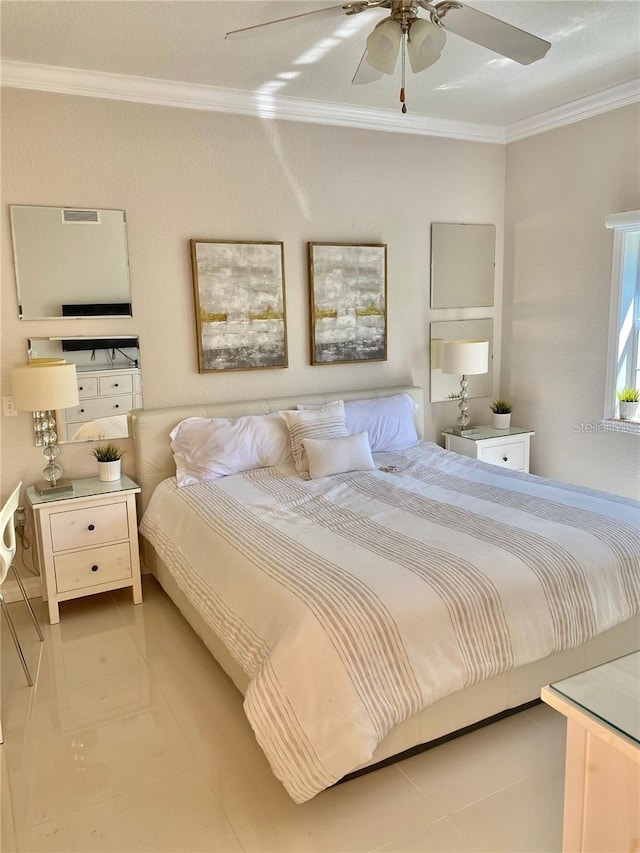 bedroom with ceiling fan and ornamental molding