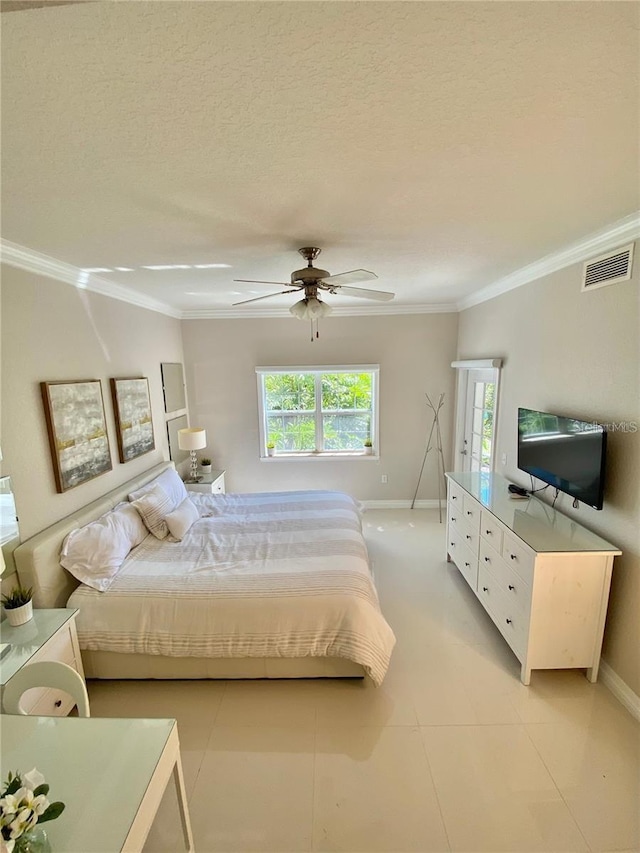 tiled bedroom with ceiling fan, ornamental molding, and a textured ceiling