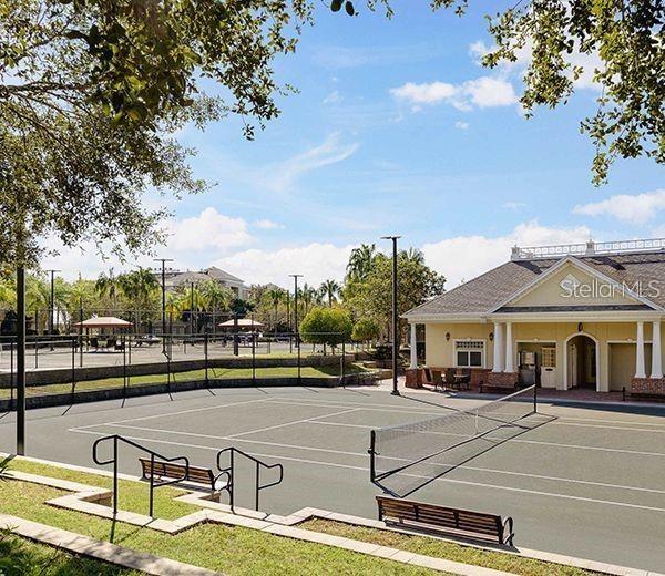 view of tennis court with fence