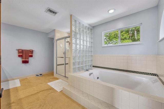 bathroom with separate shower and tub