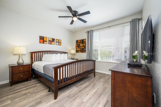 bedroom with ceiling fan and light wood-type flooring