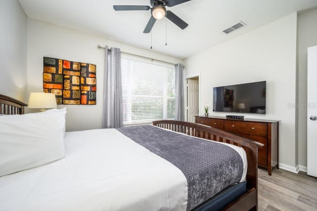 bedroom featuring light hardwood / wood-style floors and ceiling fan