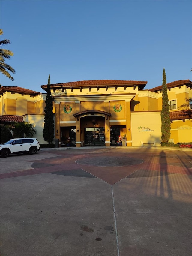 view of outdoor building at dusk