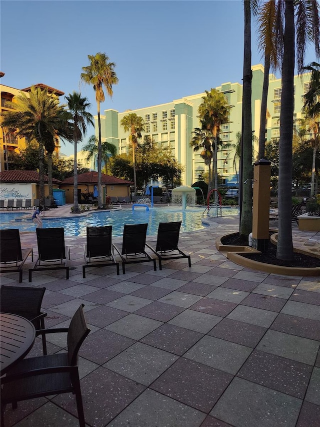 view of patio / terrace featuring pool water feature and a community pool