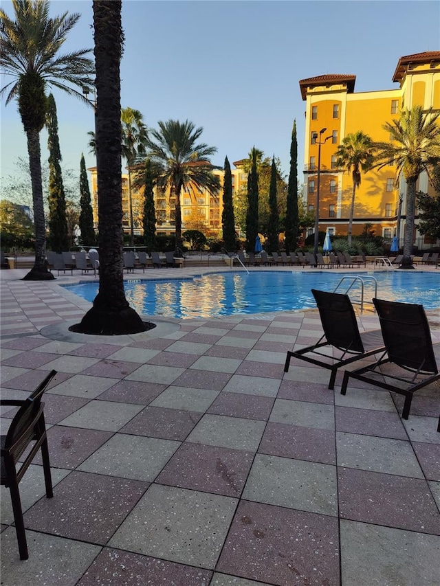 view of swimming pool with a patio