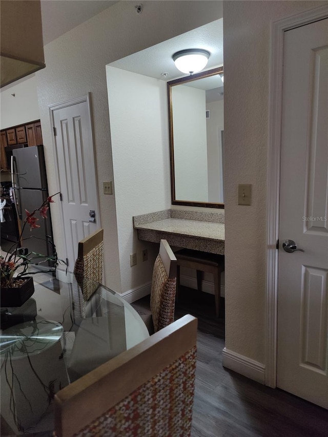 bathroom with hardwood / wood-style flooring