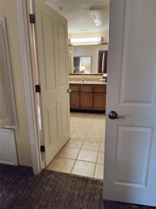 bathroom with tile patterned floors and vanity