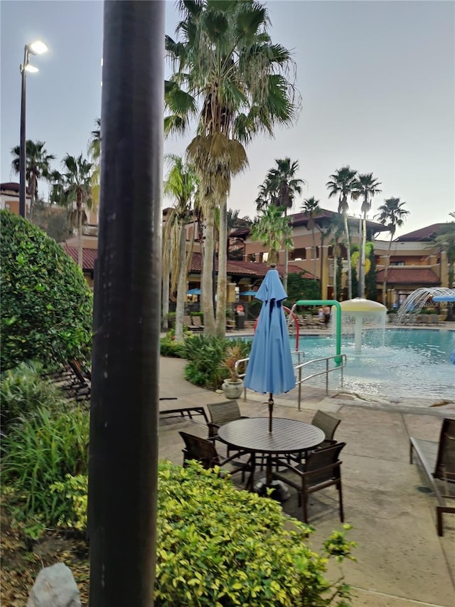 view of pool with pool water feature