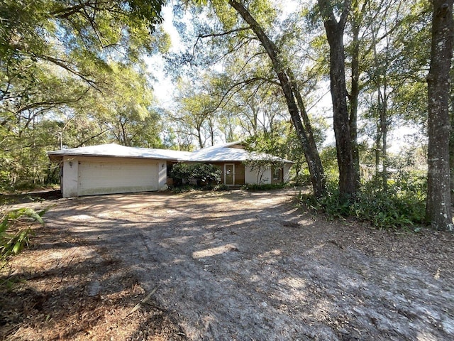 single story home featuring a garage