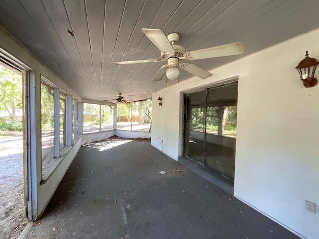 unfurnished sunroom featuring wood ceiling