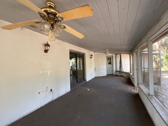 unfurnished sunroom featuring wood ceiling