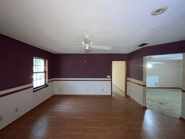 empty room with wood-type flooring and ceiling fan