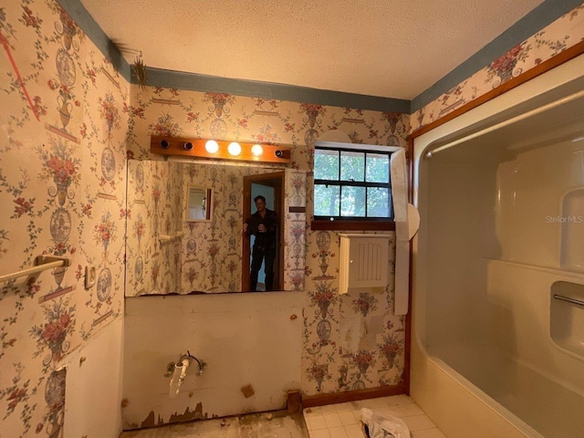 bathroom featuring toilet and a textured ceiling