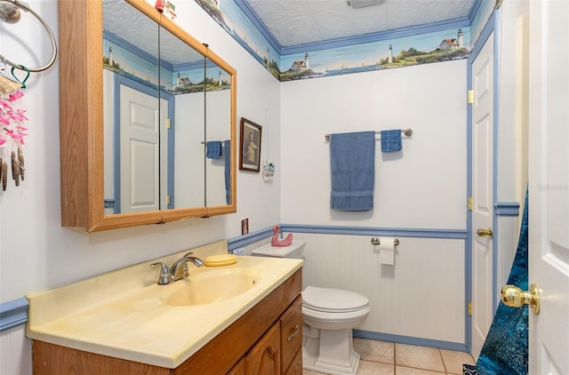 bathroom with tile patterned floors, vanity, a textured ceiling, and toilet