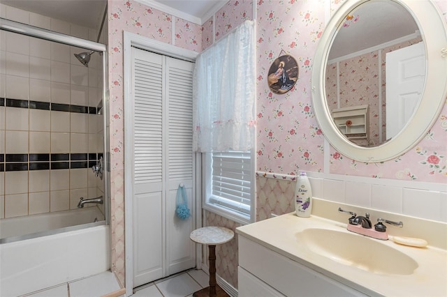 bathroom featuring crown molding, tile patterned flooring, vanity, and tiled shower / bath