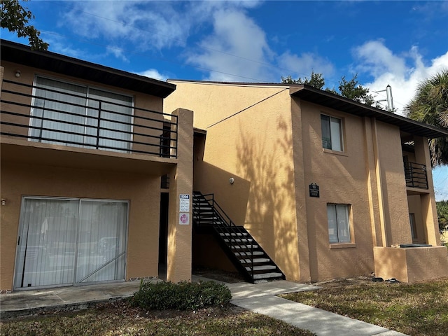 view of home's exterior with a balcony