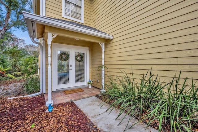 view of exterior entry featuring french doors