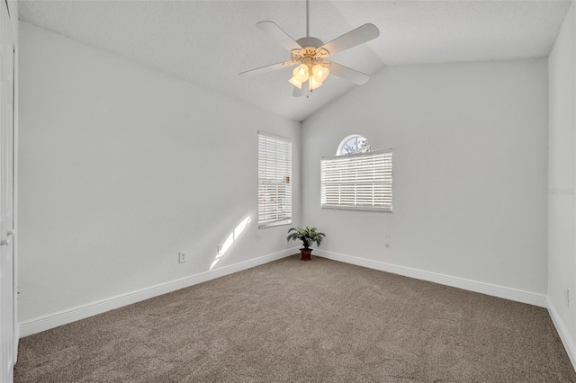 empty room with carpet flooring, ceiling fan, and lofted ceiling