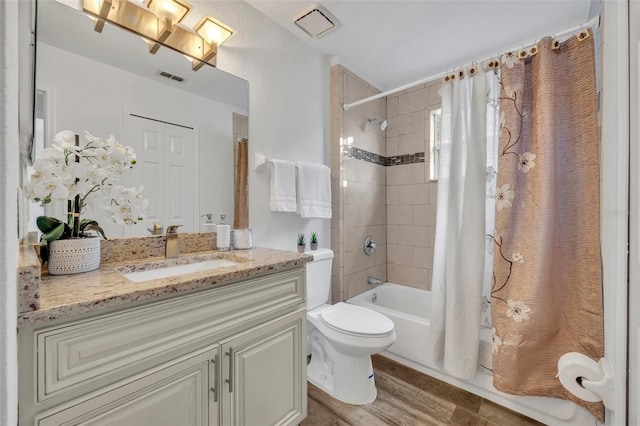 full bathroom with toilet, vanity, shower / bath combo, and hardwood / wood-style flooring