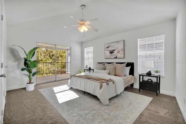 carpeted bedroom featuring ceiling fan, access to exterior, and vaulted ceiling