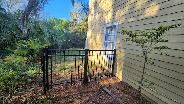 view of gate featuring fence