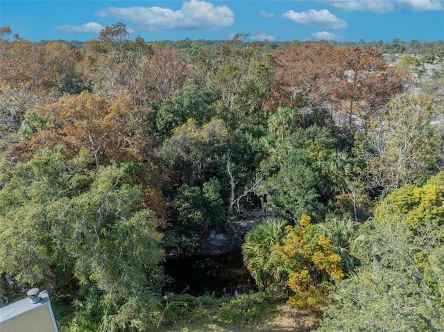 aerial view featuring a view of trees