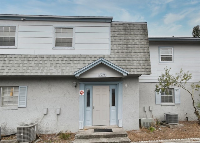 view of front of property featuring cooling unit