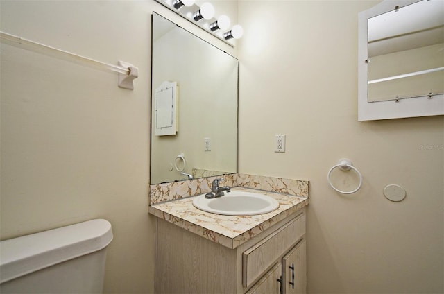 bathroom featuring vanity and toilet