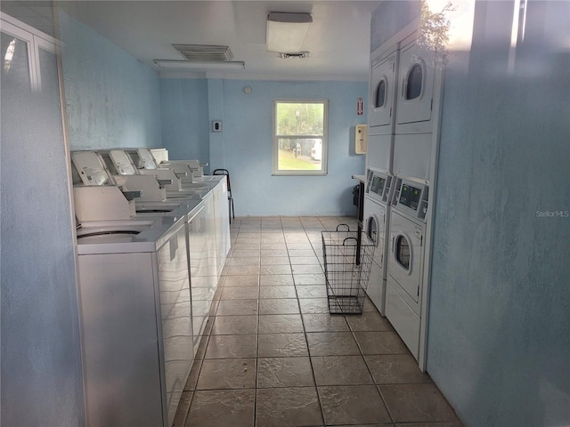 laundry area featuring washer and dryer and stacked washer / drying machine