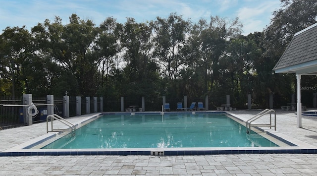 view of swimming pool with a patio area