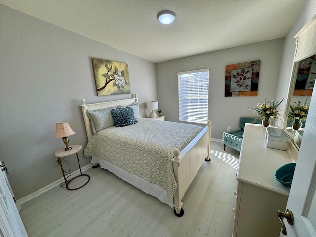 bedroom with light hardwood / wood-style floors