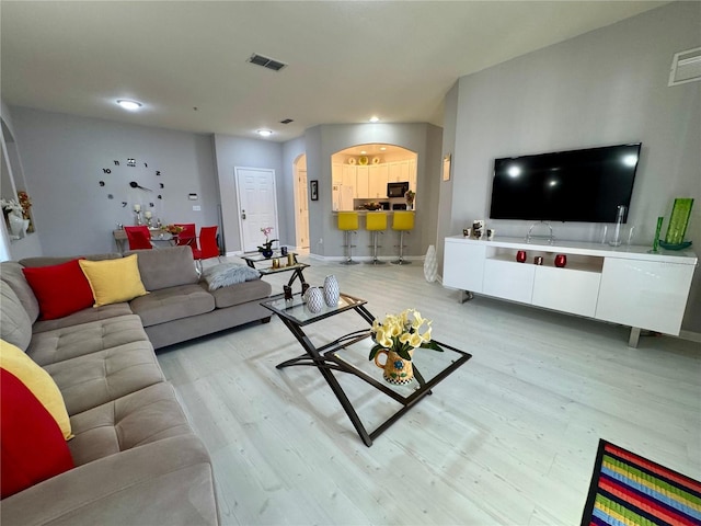 living room featuring light wood-type flooring